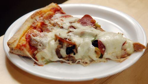 A slice of Supreme Pizza at Feliini's Pizza / AJC file photo
