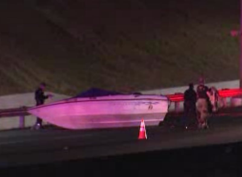 The deadly wreck involved a silver vehicle and an SUV that was towing a boat, police said. (Photo: Channel 2 Action News)