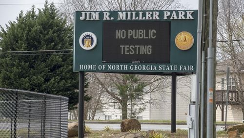 The Miller Park entrance sign informs citizens that the COVID-19 testing drive-thru is open at Miller Park in Marietta, Wednesday, March, 18, 2020. Testing is by “appointment” only and isn’t opened to the public unless with a medical referral. ALYSSA POINTER/ALYSSA.POINTER@AJC.COM
