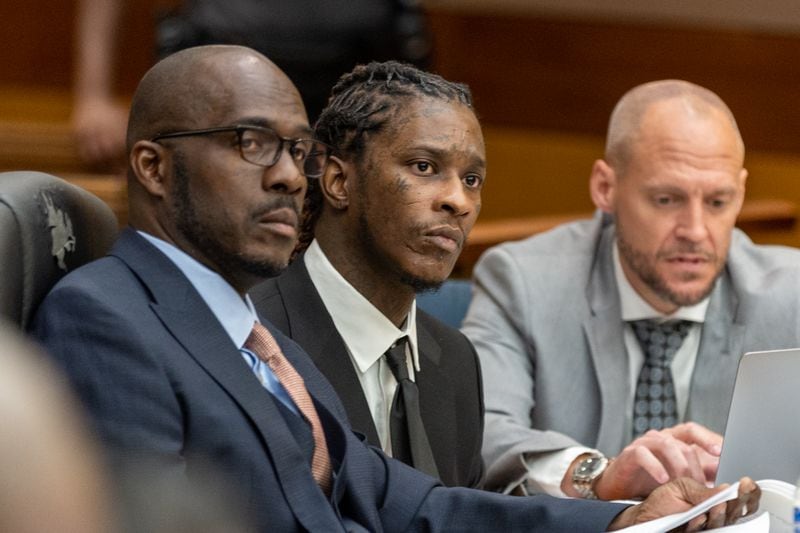 Jeffery Williams, center, the rapper known as Young Thug, made his first in-person appearance at the Fulton County Courthouse in Atlanta on Dec. 15, 2022. (Arvin Temkar / arvin.temkar@ajc.com)
