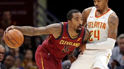 Cleveland Cavaliers' JR Smith (5) drives against Atlanta Hawks' Kent Bazemore (24) in the first half of an NBA basketball game, Sunday, Nov. 5, 2017, in Cleveland. (AP Photo/Tony Dejak)