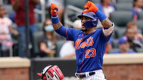 New York Mets' Javier Baez gestures with thumbs down to fans after touching home plate after his two-run home run that also scored Michael Conforto during the fourth inning against the Washington Nationals, Sunday, Aug. 29, 2021, in New York. (Corey Sipkin/AP)