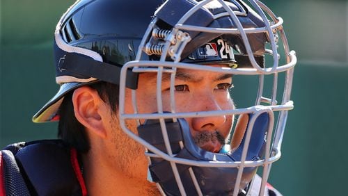 In this file photo, Braves catcher Kurt Suzuki Braves catcher Kurt Suzuki concentrates while working the plate in February at the ESPN Wide World of Sports in Lake Buena Vista. Curtis Compton/ccompton@ajc.com