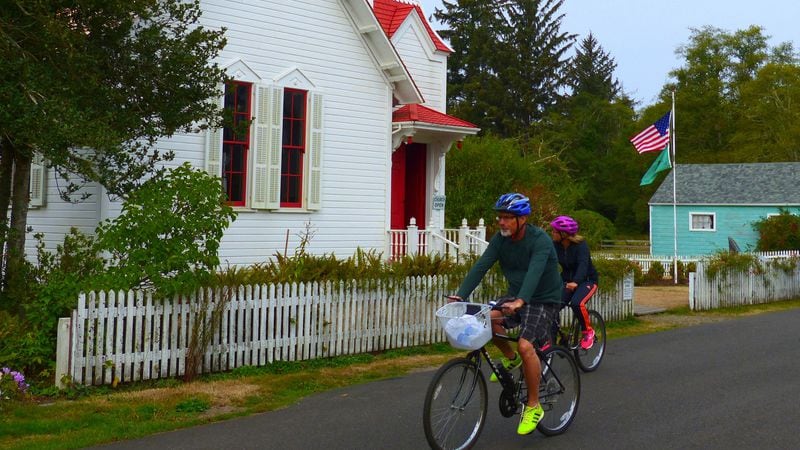 Cyclists pass the old Oysterville Church, a gift to the community from founding father R.H. Espy, who donated the land and money for construction in 1892. (Brian J. Cantwell/Seattle Times/TNS)