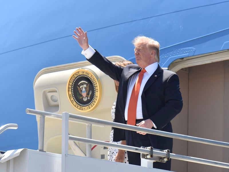 President Donald Trump waves as he arrives in Atlanta for an opioid summit on April 24, 2019.