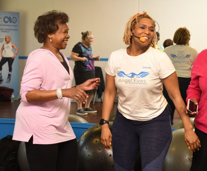 Kay Jordan of Atlanta (left) exercises as Dawn Wells (right) teaches a recent class at Dawn Wells Fitness in Covington. The class was for the blind and visually impaired. CONTRIBUTED BY REBECCA BREYER