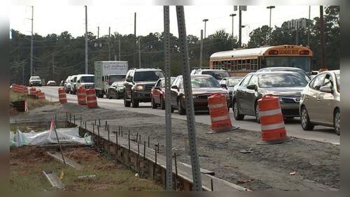 Someone drove through a construction zone in Cobb County and hit a worker, police said.