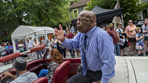 April 25, 2015 Atlanta - Congressman John Lewis blows kisses to the crowd as he rides in the parade during the Inman Park Festival in Atlanta on Saturday, April 25, 2015. The two day festival featured artists, musicians, food, a tour of homes, the parade and activities for children.   JONATHAN PHILLIPS / SPECIAL