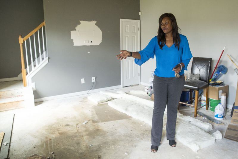 07/02/2018 — Fairburn/South Fulton, GA - Tracy Stalling shows the construction progress at her residence in the Chestnut Ridge subdivision in South Fulton, Monday, July 2, 2018. After having issues with contractors, Tracy tries to visit her house everyday in order to make sure her windows and doors are secure. ALYSSA POINTER/ALYSSA.POINTER@AJC.COM