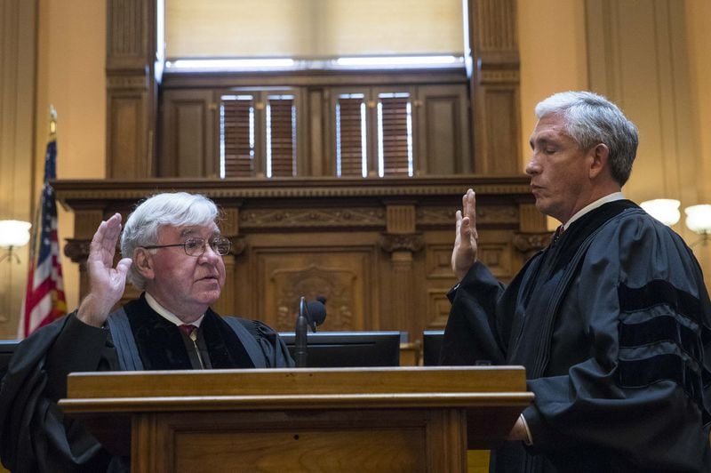 09/04/2018 — Atlanta, Georgia — Retired Georgia Supreme Court Chief Justice P. Harris Hines (left) swears in Justice David Nahmias (right) as a new presiding Justice during the oath taking ceremony for the Georgia Supreme Court at the State Capitol in Atlanta, Thursday, August 30, 2018. (ALYSSA POINTER/ALYSSA.POINTER@AJC.COM)