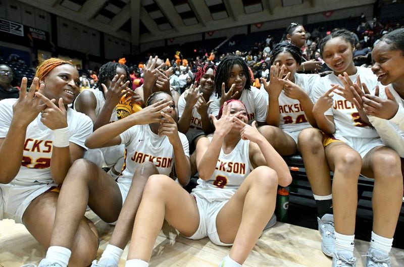 Jackson-Atlanta players celebrate their victory over Midtown during GHSA Basketball Class 5A Girl’s State Championship game at the Macon Centreplex, Thursday, Mar. 7, 2024, in Macon. Jackson-Atlanta won 58-44 over Midtown. (Hyosub Shin / Hyosub.Shin@ajc.com)