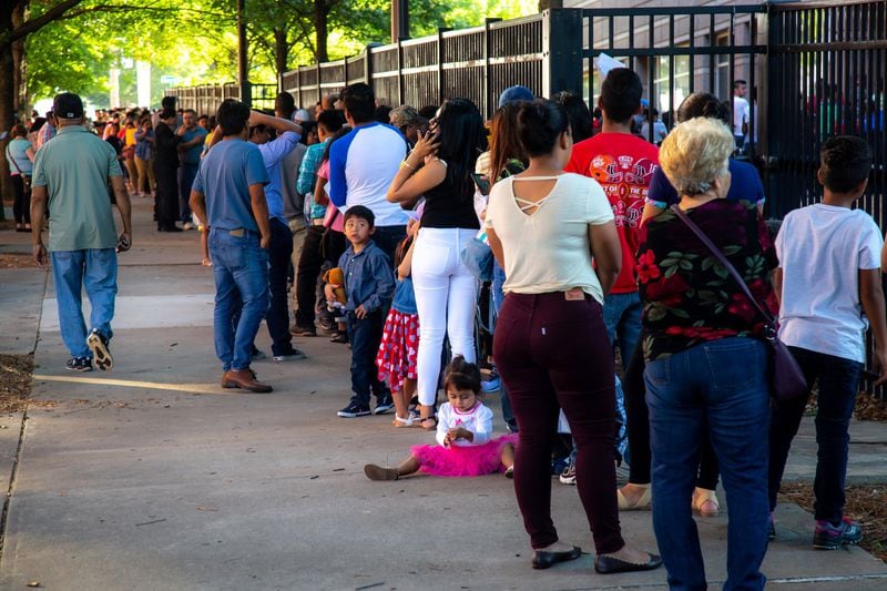 Long lines form outside the Atlanta Immigration Court Tuesday morning, July 2, 2019. STEVE SCHAEFER / SPECIAL TO THE AJC