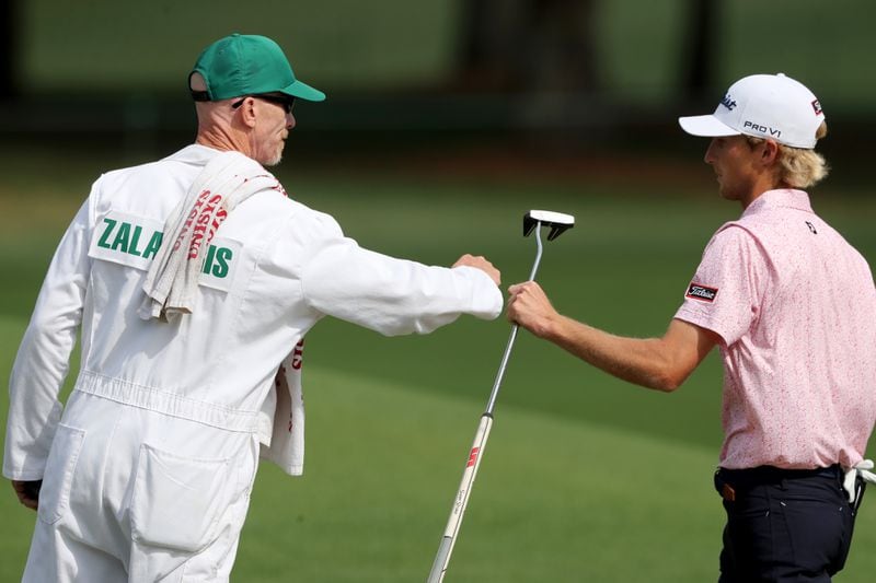 Will Zalatoris and his caddie Ryan Goble celebrate after Zalatoris made a birdie on the eighth hole during the final round of the Masters Tournament Sunday, April 11, 2021, at Augusta National Golf Club in Augusta. (Curtis Compton/ccompton@ajc.com)
