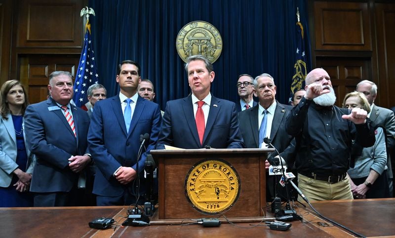 March12, 2020 Atlanta - Gov. Brian Kemp speaks as other officials standing behind during a press conference to provide an update on the state's efforts regarding COVID-19, after reporting the first death in Georgia related to coronavirus, at the Georgia State Capitol on Thursday, March 11, 2020. (Hyosub Shin / Hyosub.Shin@ajc.com)