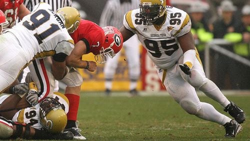 Georgia Tech's Darryl Richard (95) prepares to hit UGA quarterback Matthew Stafford from the front as Derrick Morgan (91) hits him from the side while  Elris Anyaibe (94) holds his leg on Saturday, November, 29, 2008 in Athens. JOHNNY CRAWFORD/ AJC file