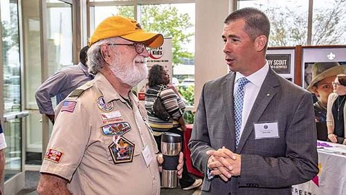 Boy Scouts volunteer Rogers Young (left) and Deputy Scout Executive Jason Volz speak during a break in the 2018 seminar.