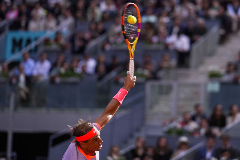 Rafael Nadal of Spain serves to Darwin Blanch of United States during the Mutua Madrid Open tennis tournament in Madrid, Thursday, April 25, 2024. (AP Photo/Manu Fernandez)