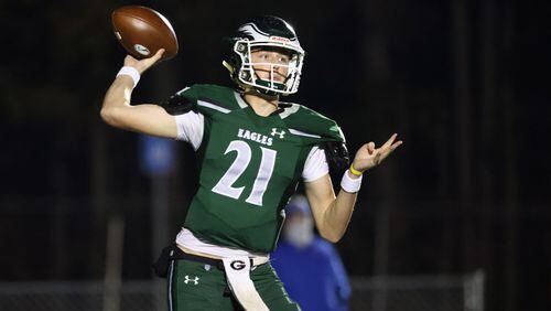Dec. 11, 2020 - Suwanee, Ga: Collins Hill quarterback Sam Horn (21) attempts a pass against Parkview in the first half of the Class AAAAAAA quarterfinals game at Collins Hill high school Friday, December 11, 2020 in Suwanee, Ga.. JASON GETZ FOR THE ATLANTA JOURNAL-CONSTITUTION




