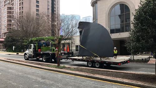 A large piece of metal fell from a building at 14th and West Peachtree streets in Midtown, Atlanta police said.