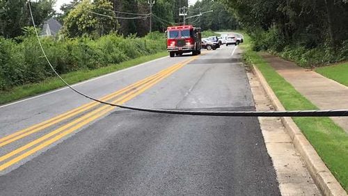 A road in north Fulton County is closed Thursday after a power line fell, blocking the road.