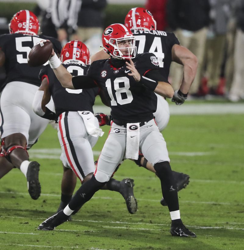 Bulldogs quarterback JT Daniels (18) competes a pass on their second possession against Mississippi State Saturday, Nov. 21, 2020, at Sanford Stadium in Athens. (Curtis Compton / Curtis.Compton@ajc.com)