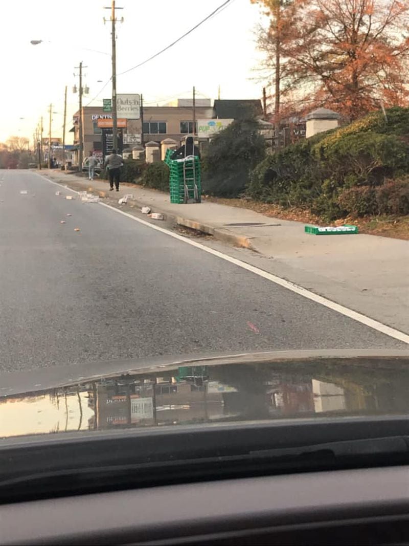 A Krispy Kreme delivery truck spilled dozens of doughnuts onto Peachtree Road.