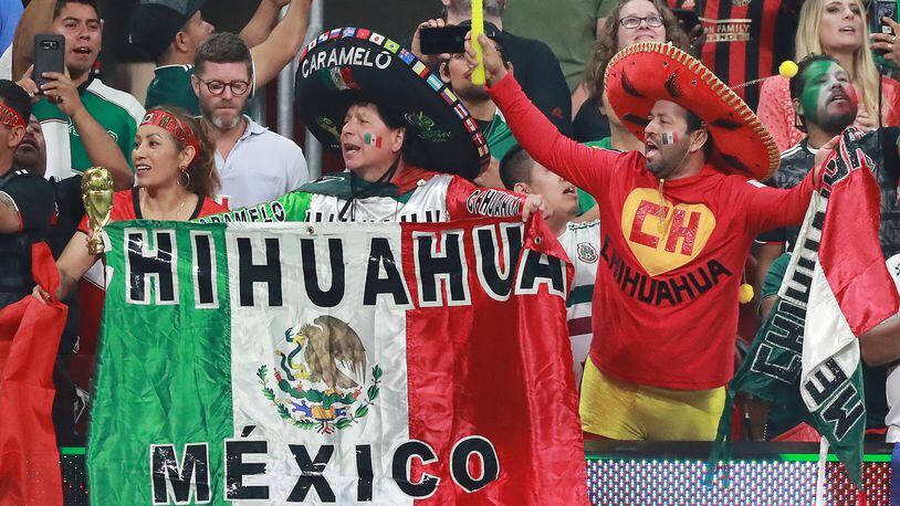 Mexico fans cheer their team to victory.  Curtis Compton/ccompton@ajc.com