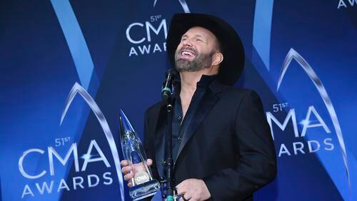 Garth Brooks holds his Entertainer of the Year award backstage at the CMA Awards on Nov. 8, 2017, in Nashville. (Photo by Evan Agostini/Invision/AP)