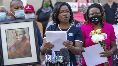 Monteria Robinson (center) speaks about her late son, Jamarion Robinson, during a press conference on the steps of the Georgia State Capitol Building in Atlanta, Tuesday, June 2, 2020. Jamarion Robinson, 26, was shot by officers more than 50 times on Aug. 5, 2016. Monteria Robinson spoke again about her son’s death during a Saturday, June 27, 2020 rally with the Atlanta NAACP. ALYSSA POINTER / ALYSSA.POINTER@AJC.COM