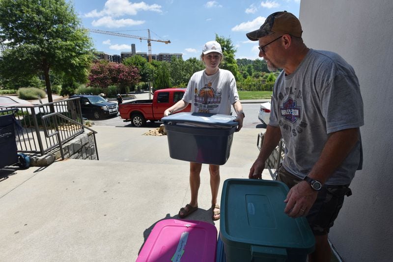 Jack Ferguson helps his daughter Julie Ferguson, 25, move July 8, 2017 into her new apartment at AMLI Old 4th Ward, where the least expensive one bedroom is advertised at $1,751. Beltline planners had evidence 10 years ago that real estate prices would jump and housing experts raised concerns this could push elderly, middle- and working-class residents from the historically black neighborhood. HYOSUB SHIN / HSHIN@AJC.COM
