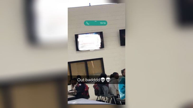 A blurred image from what students shared on social media after a lewd video played in the cafeteria at Mount Zion High School.