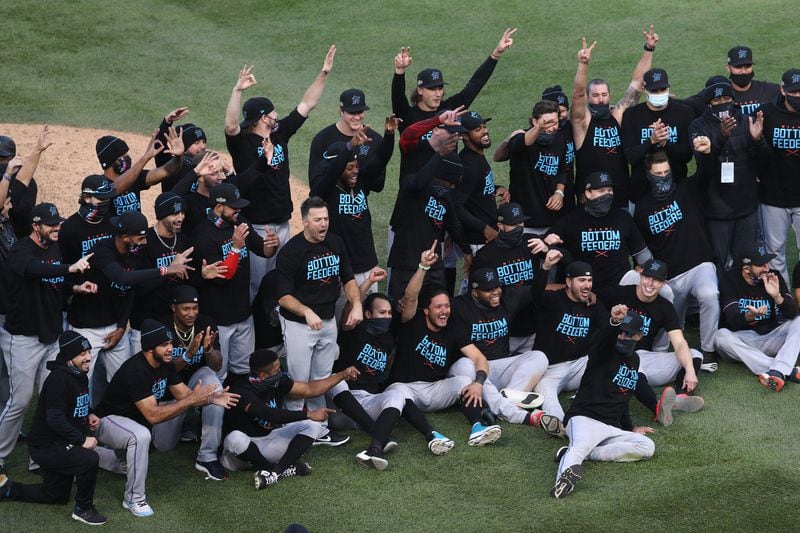 The Miami Marlins celebrate after a 2-0 series-clinching victory against the Chicago Cubs in Game 2 of the National League Wild Card series at Wrigley Field in Chicago on Friday, Oct. 2, 2020. (Chris Sweda/Chicago Tribune)