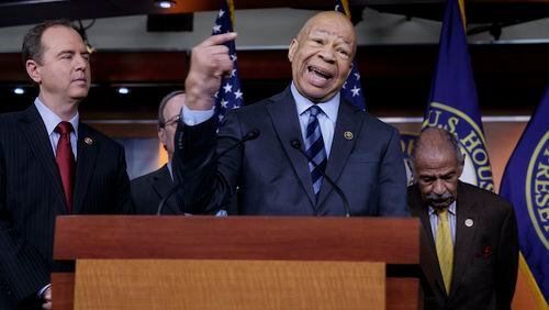 Rep. Elijah Cummings, D-Md., ranking member of the House Oversight and Government Reform Committee, flanked by Rep. Adam Schiff, D-Calif., ranking member of the House Permanent Select Committee on Intelligence, left, and Rep. John Conyers, D-Mich., ranking member of the House Judiciary Committee, join other top House Democrats to say they want an investigation into President Donald Trump's relationship with Russia, including when Trump learned that his national security adviser, Michael Flynn, had discussed U.S. sanctions with a Russian diplomat, during a news conference on Capitol Hill in Washington, Tuesday, Feb. 14, 2017.    (AP Photo/J. Scott Applewhite)