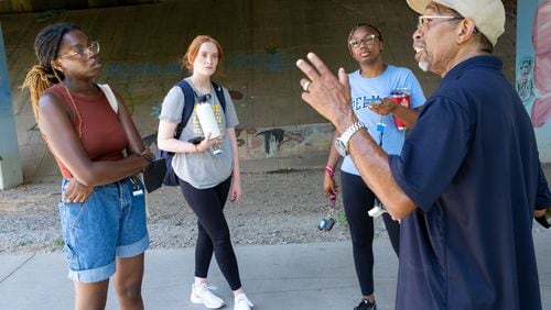 FILE: Georgia Tech students Zarya Ajasin, from left, and Meg Sanders and Spelman student Sommer Madison listen to Darryl Haddock, director of environmental education for the West Atlanta Watershed Alliance as they mapped temperatures along the Westside Beltline on Wednesday, June 15, 2022, for a research study. Ben Gray for the Atlanta Journal-Constitution
