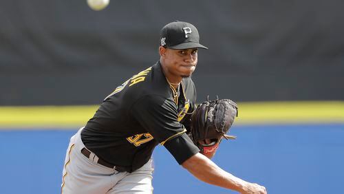 Edgar Santana of the Pittsburgh Pirates warms up during the fourth inning of a spring training baseball game against the Toronto Blue Jays Monday, March 2, 2020, in Dunedin, Fla. (AP Photo/Frank Franklin II)