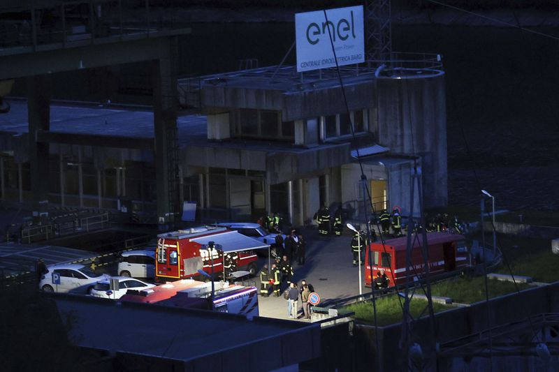 Emergency personnel work at the scene of an explosion that occurred at the hydroelectric plant at the Suviana Dam, Italy, Tuesday, April 9, 2024. Italian media are reporting that an explosion at a hydroelectric plant Tuesday in the Apennine Mountains south of Bologna has left at least three people dead and another six reported missing. The explosion occurred at the hydroelectric plant at the Suviana Dam, some 70 kilometers southwest of Bologna. (Michele Nucci/LaPresse via AP)