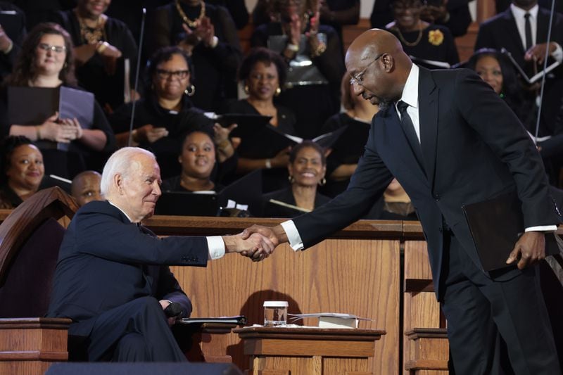 President Joe Biden shakes hands with Sen. Raphael Warnock (D-Ga.) before delivering remarks at Ebenezer Baptist Church in Atlanta on Sunday, Jan. 15, 2023, the day before Martin Luther King Jr. Day. (Oliver Contreras/The New York Times)