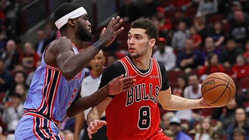Zach LaVine of the Chicago Bulls moves against B.J.Johnson  of the Atlanta Hawks at the United Center on March 03, 2019 in Chicago, Illinois.