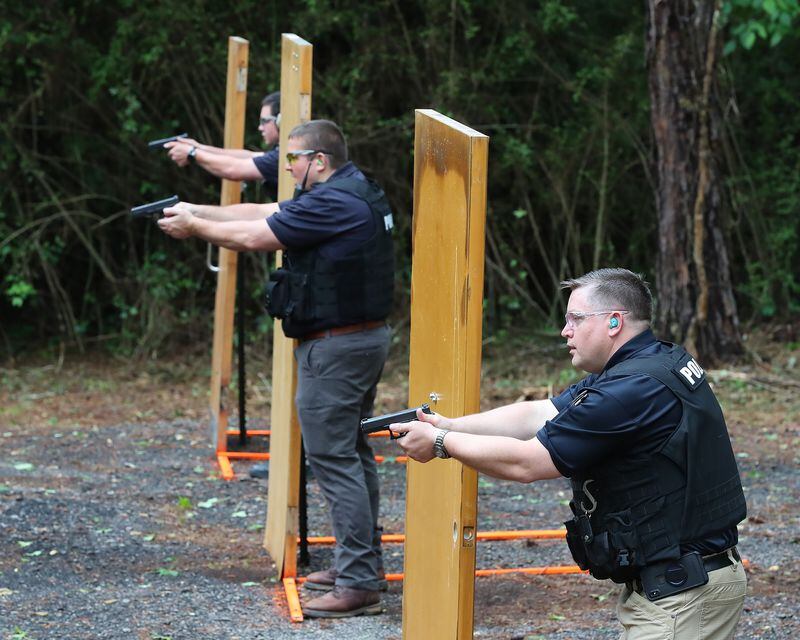 LaGrange police officer Michael Shaw, from left, and detectives Darrell Prichard, and Brian Brown run through a training session practicing the new technique. (Curtis Compton / Curtis.Compton@ajc.com)