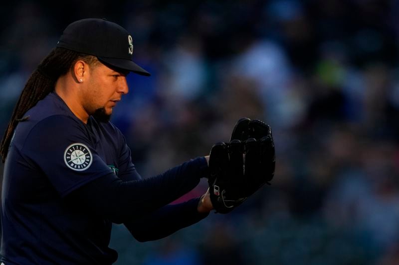 Seattle Mariners starting pitcher Luis Castillo prepares to throw against the Atlanta Braves during the fourth inning of a baseball game Tuesday, April 30, 2024, in Seattle. (AP Photo/Lindsey Wasson)