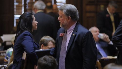 Georgia House Appropriations Chairman Terry England, R-Auburn, talks with Deputy House Budget Director Christine Murdock after the state’s $25 billion budget gains final passage. BOB ANDRES / BANDRES@AJC.COM
