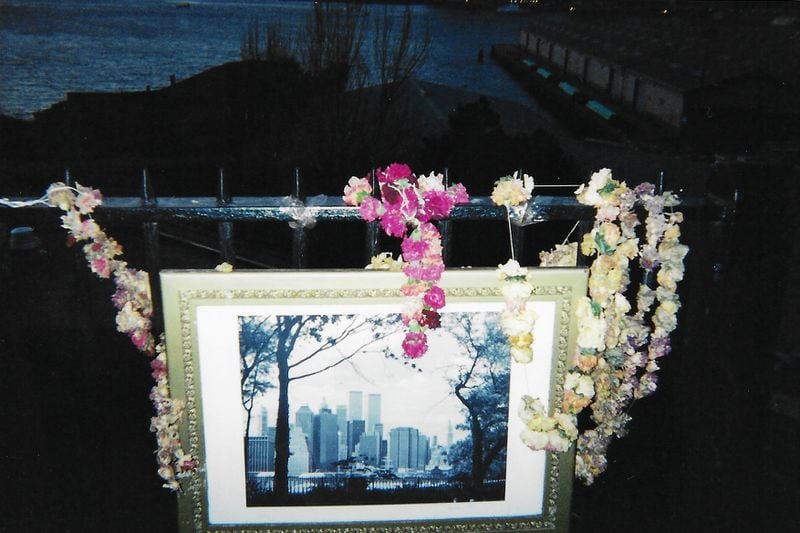 A makeshift memorial to the Twin Towers just months after 9/11. (Nedra Rhone / nedra.rhone@ajc.com)