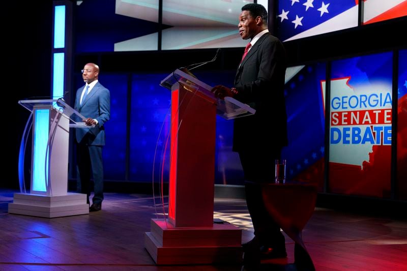 The race between U.S. Sen. Raphael Warnock, left, and Republican Herschel Walker will continue for another four weeks after each failed to win a majority of the votes cast in Tuesday's election.