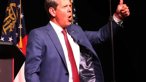 052422 Atlanta: Governor Brian Kemp reacts to cheering supporters as he take the stage to deliver his election night party speech at the College Football Hall of Fame on Tuesday, May 24, 2022, in Atlanta.    “Curtis Compton / Curtis.Compton@ajc.com”