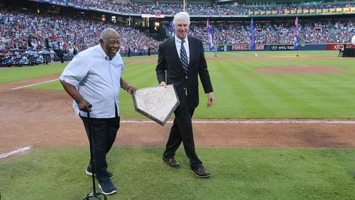 Hank Aaron and Braves Chairman & CEO Terry McGuirk removed home plate at the conclusion of the final game at Turner Field, then transfered it to the new SunTrust Park in Cobb County. (Curtis Compton /ccompton@ajc.com)