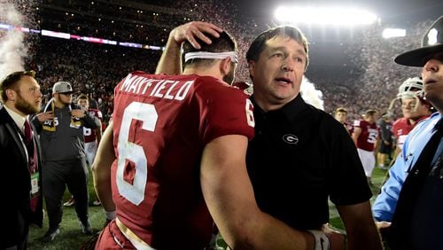 PASADENA, CA - JANUARY 01:  Head Coach Kirby Smart of the Georgia Bulldogs hugs quarterback Baker Mayfield #6 of the Oklahoma Sooners after the Bullsdogs beat the Oklahoma Sooners 54-48 in double overtime in the 2018 College Football Playoff Semifinal Game at the Rose Bowl Game presented by Northwestern Mutual at the Rose Bowl on January 1, 2018 in Pasadena, California.  (Photo by Harry How/Getty Images)
