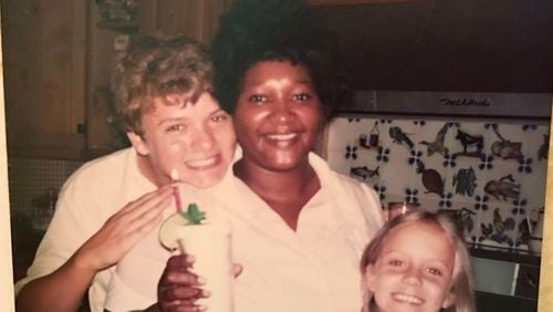 Chris and his sister Katie celebrate Shirley's birthday with a special iced tea made with fresh lemon, mint from the garden and a candle.