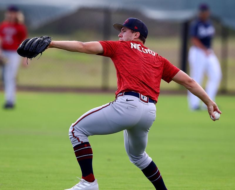 Braves pitcher J.J. Niekro loosens up his arm during the Braves minor league spring training camp on Tuesday, March 8, 2022, in North Port.  “Curtis Compton / Curtis.Compton@ajc.com”`