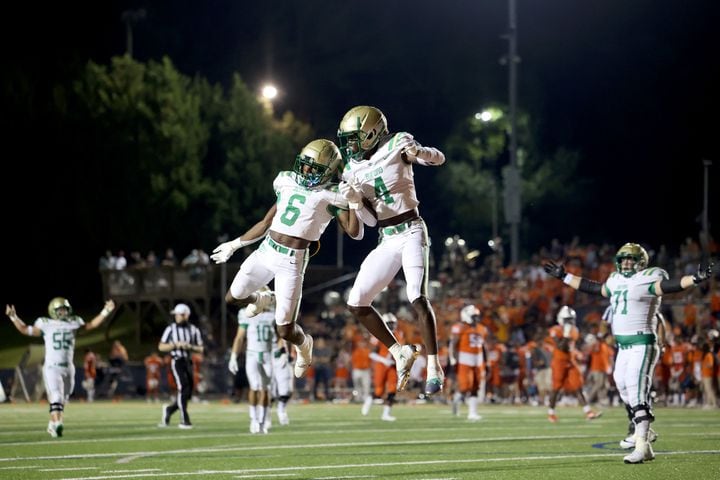 August 20, 2021 - Kennesaw, Ga: Buford wide receiver Tobi Olawale (4) celebrates his receiving touchdown with running back Victor Venn (6) during the second half against North Cobb at North Cobb high school Friday, August 20, 2021 in Kennesaw, Ga.. Buford won 35-27. JASON GETZ FOR THE ATLANTA JOURNAL-CONSTITUTION
