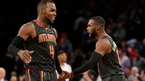 Atlanta Hawks’ Paul Millsap, left, and Tim Hardaway Jr. celebrate after an NBA basketball game against the New York Knicks, Monday, Jan. 16, 2017 in New York. The Hawks defeated the Knicks 108-107. (AP Photo/Seth Wenig)